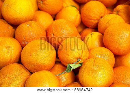 Pile Of Organic Oranges At Market Stall