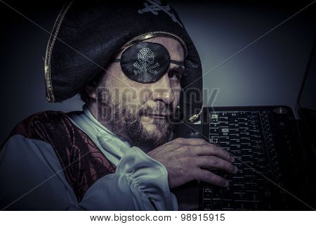 Piracy, computer security, hacker pirate dress with hat and skull