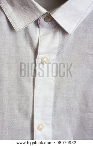 White shirt close up. Collar and buttons