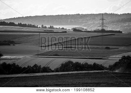 View of the small town of Neustadt (Marburg-Biedenkopf district in Hessen) a suburb and surrounding agricultural land. Black and white.