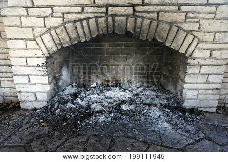 Ashes collect in the fireplace of the historic Shorewood Grove Shelter, in the Hammel Woods Forest Preserve in Shorewood, Illinois.