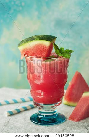 Watermelon drink in glasses with slices of watermelon and mint. Slective focus