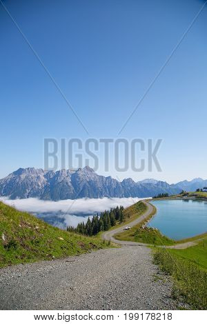Austrian Alps Salzburg Leogang. Blue Sky Morning Fog Beautiful Scenery Austrian Alps In Summer