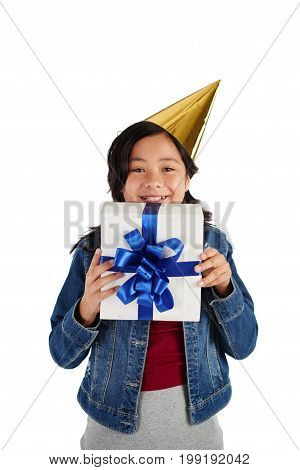 Studio shot of excited mixed-race girl with her birthday present