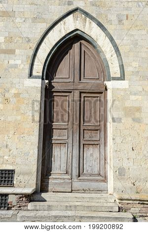 Siena Italy - 6 July 2017: Door of Salimbeni palace on Duomo square at Siena in Italy