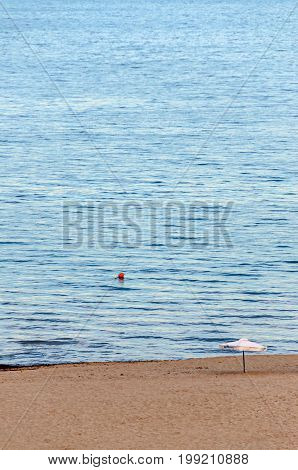 Single Sun Umbrella At The Black Sea Shore From Albena, Bulgaria With Golden Sands, Blue Fresh Water