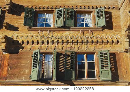 ROUGEMONT, SWITZERLAND - DECEMBER 09, 2009: Exterior of the traditional Swiss chalet in Rougemont, Switzerland. Rougemont is a famous tourist destination in Switzerland.