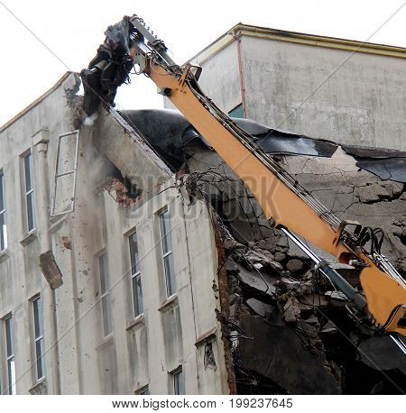 Debris Falling as a Tall Building is Demolished.