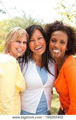 Diverse group of friends talking and laughing.