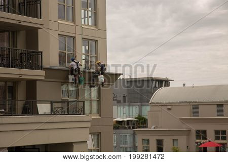 Safety measures workinh high altitute highrise building exterior cleaning