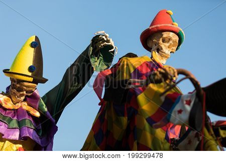 skeletons clown dresses colorful halloween close up