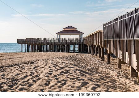 The public viewing pier at Buckroe Beach in Hampton, Virginia, which has a wooden viewing deck and gazebo.