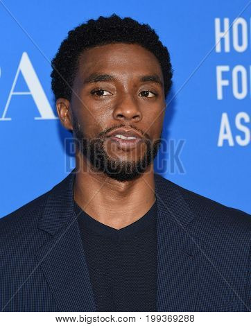 LOS ANGELES - AUG 02:  Chadwick Boseman arrives for the HFPA's Grants Banquet on August 2, 2017 in Beverly Hills, CA                