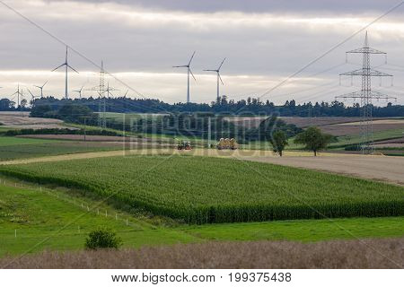 Agricultural machinery on the fields in the suburbs of the small town of Neustadt (Marburg-Biedenkopf district in Hessen).