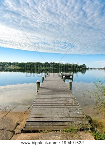 Fishing pier and boat launch in Bayview Park on Bayou Texar in Pensacola Florida in early morning light