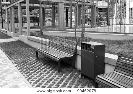 Park Bench In A Spring Garden.