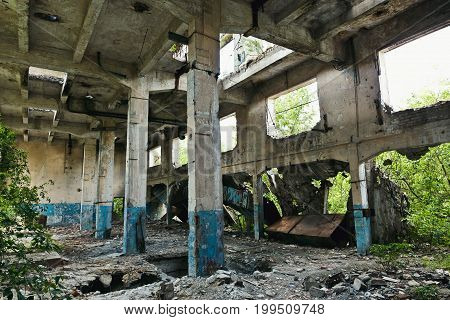 Big abandoned warehouse with columns, ruined walls, post apocalipse concept