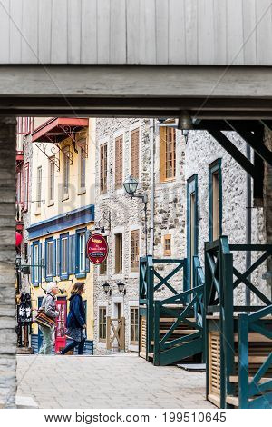 Quebec City Canada - May 30 2017: Lower old town cobblestone street called Sous le Fort with restaurants and Boutique La Chasse-galerie