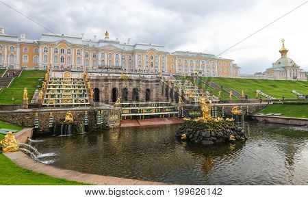 SAINT PETERSBURG RUSSIA - MAY 23 2017: Scenic view of the Grand Cascade The Peterhof Palace and Gardens complex is recognized as a UNESCO World Heritage Site