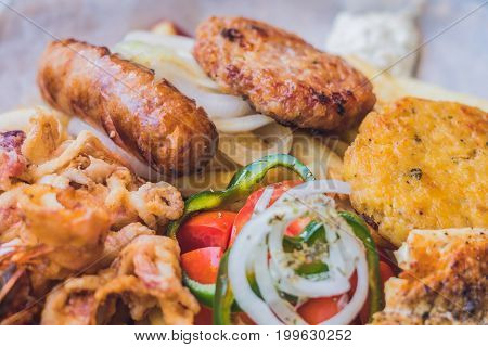 Big Set Greek Food Meat Plate With Potatoes And Sauce
