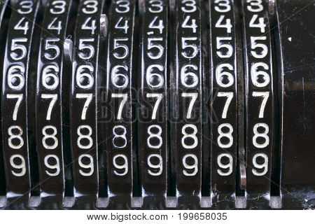 Old Rusty Retro Calculator Black Standing On A Wooden Table