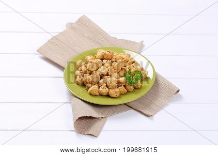 plate of soy meat cubes on beige place mat