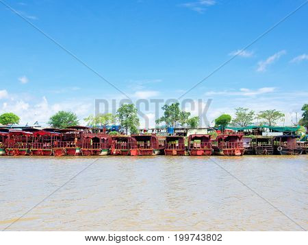 Siem Reap Cambodia - October 29 2016: Tourist boats are at anchor at the bank of Tonle Sap the large freshwater lake in Siem Reap Cambodia.