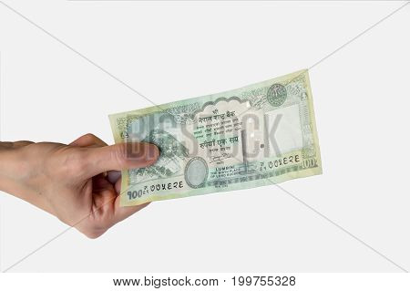 Woman Holding A Hundred Nepal Rupees Note In Her Hand