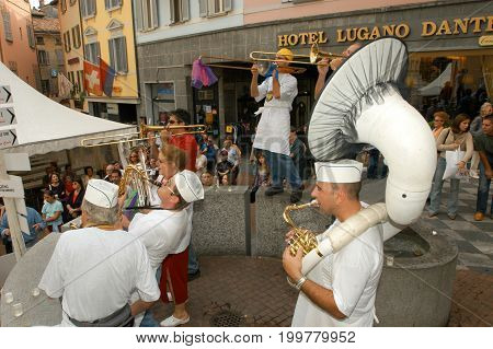 People Performing Gugge Music At The Carnival Of Lugano