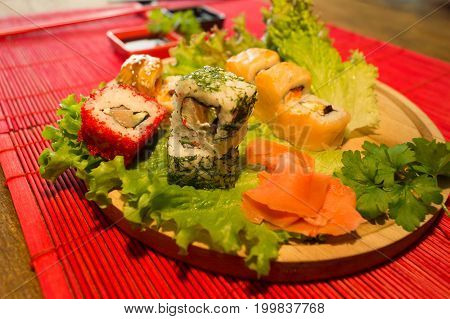 People eat sushi and rolls Japanese restaurant