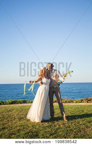 Just married couple embraced on nature. Bride and groom.