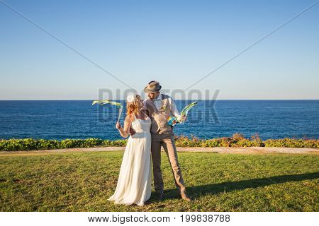 Just married couple embraced on nature. Bride and groom.