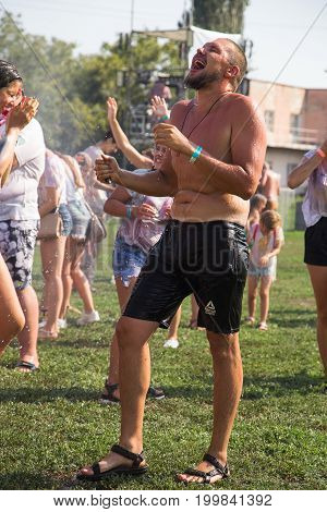 Odessa, Ukraine - August 5, 2017: Water Festival. Party Wet. Hands And Happy People Crowd Partying U