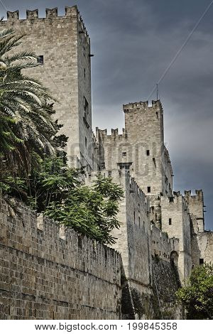The moat and turrets of the medieval castle of the Joannite Order in the city of Rhodes