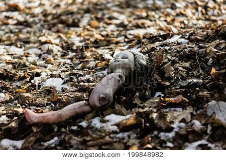 old destroyed creepy doll of chernobyl that is abandoned in the woods