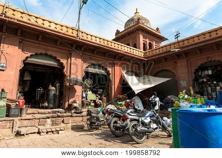 JODHPUR RAJASTHAN INDIA - MARCH 04 2016: Horizontal picture of motorcycle workshop in Jodhpur the blue city of Rajasthan in India.