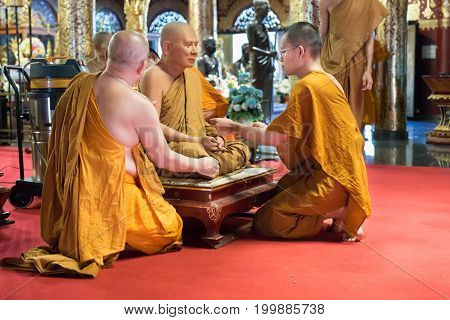 Buddhist Monk Clean And Remove Dust From Monk Waxwork Robe
