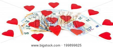 Red heart on euro banknotes bills. On white background. love and money