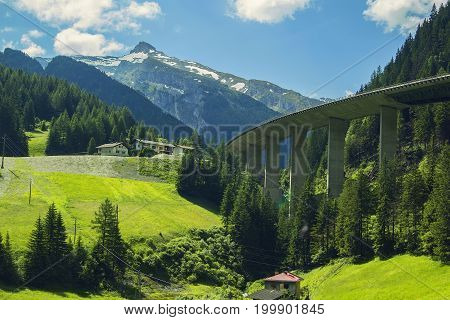 Background view of the mountain peaks of the Alps and high-speed road in the mountains near Bolzano