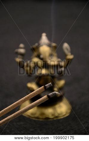 Ganesha on black background close up photo