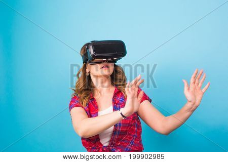 Happy young woman using a virtual reality headset