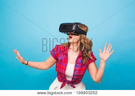 Happy young woman using a virtual reality headset