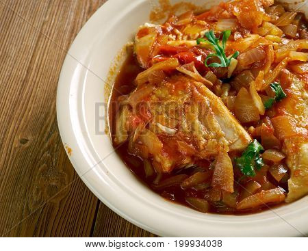 Stew Chicken from Belize.just chicken red recado onion and water.