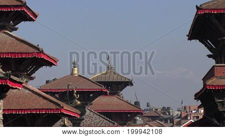 King Yoganarendra Malla in middle of the temples he built in 17th century
