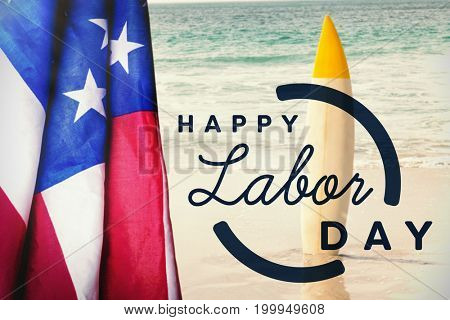 Digital composite image of happy labor day text with blue outline against surfboard in sand