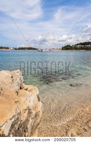 Gravel Beach With Rocks On The Croatian Coast, Clear Water