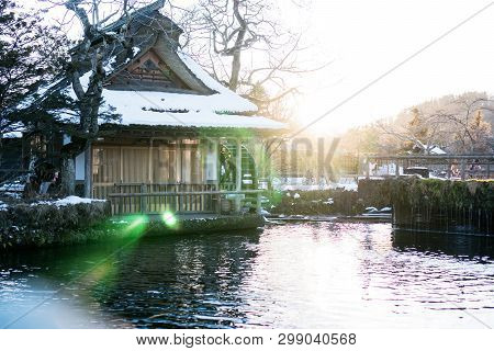 Traditional Japanese Style House At Oshino Hakkai With Mt.fuji With Flare Light. Landmark Of Life Ja