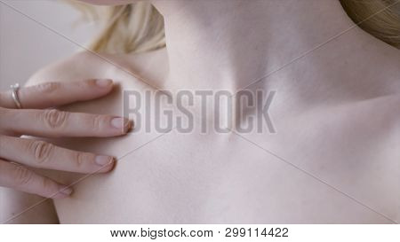 Female Clavicles And Neck. Action. Female Clavicle. Perfect Skin Of A Young Woman Close-up