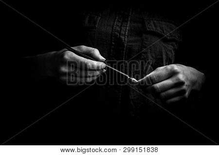 Female Hand Elegantly Holding An Ink Pen With A Metal Tip Close-up On A Black Background. Classic Fo