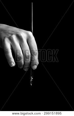 Female Hand Elegantly Holding An Ink Pen With A Metal Tip Close-up On A Black Background. Classic Fo